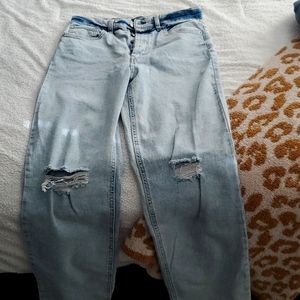 Wide fable high waist distressed jeans in size 10. BRAND NEW!